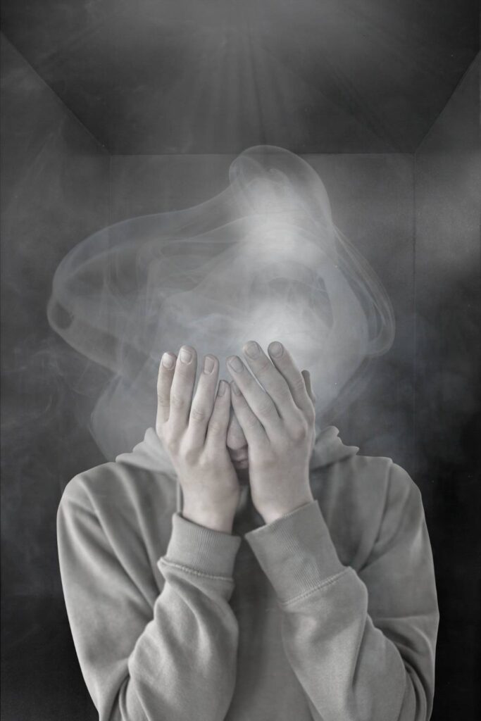 Illustration of a frustrated person with a cloud of frustration at the place of their head, covering their face with hands.